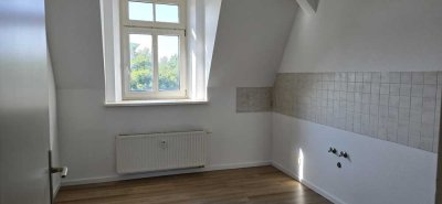 Gemütliche 1-Zimmer-Wohnung im Dachgeschoss mit Stellplatz in zentraler Lage
