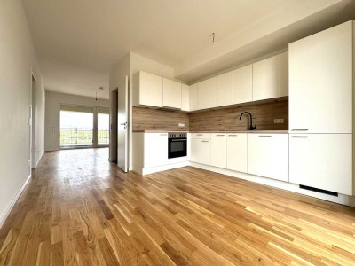 Erstbezug: gemütliche 4-Raum-Wohnung mit Einbauküche, Balkon und Tageslichtbad